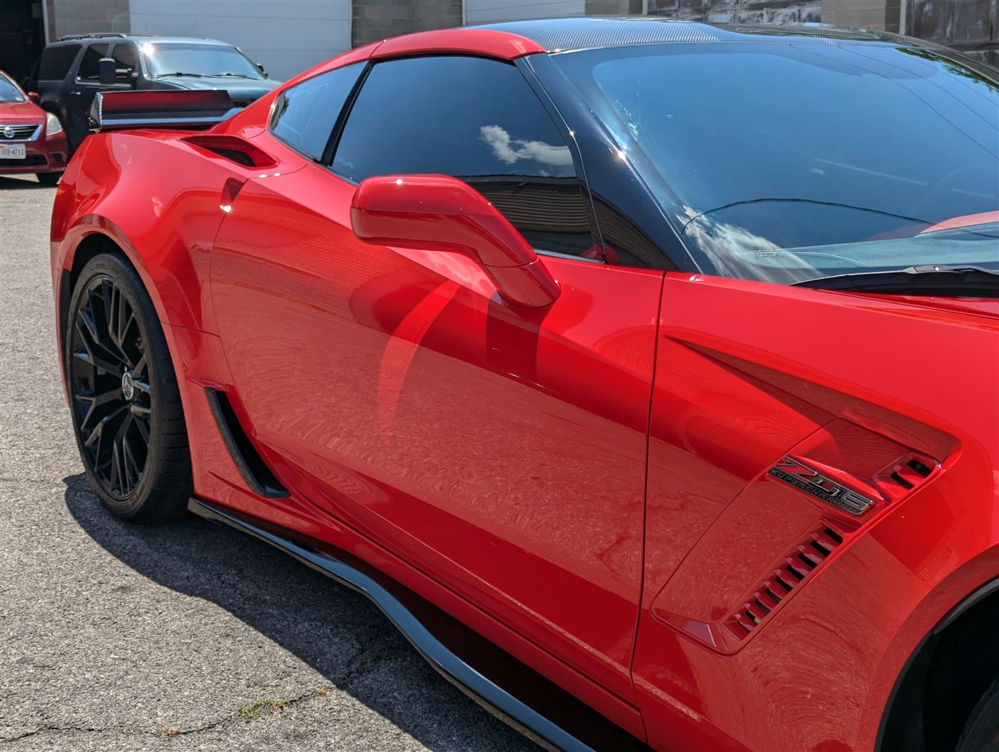 Red Corvette Z06 with freshly tinted windows